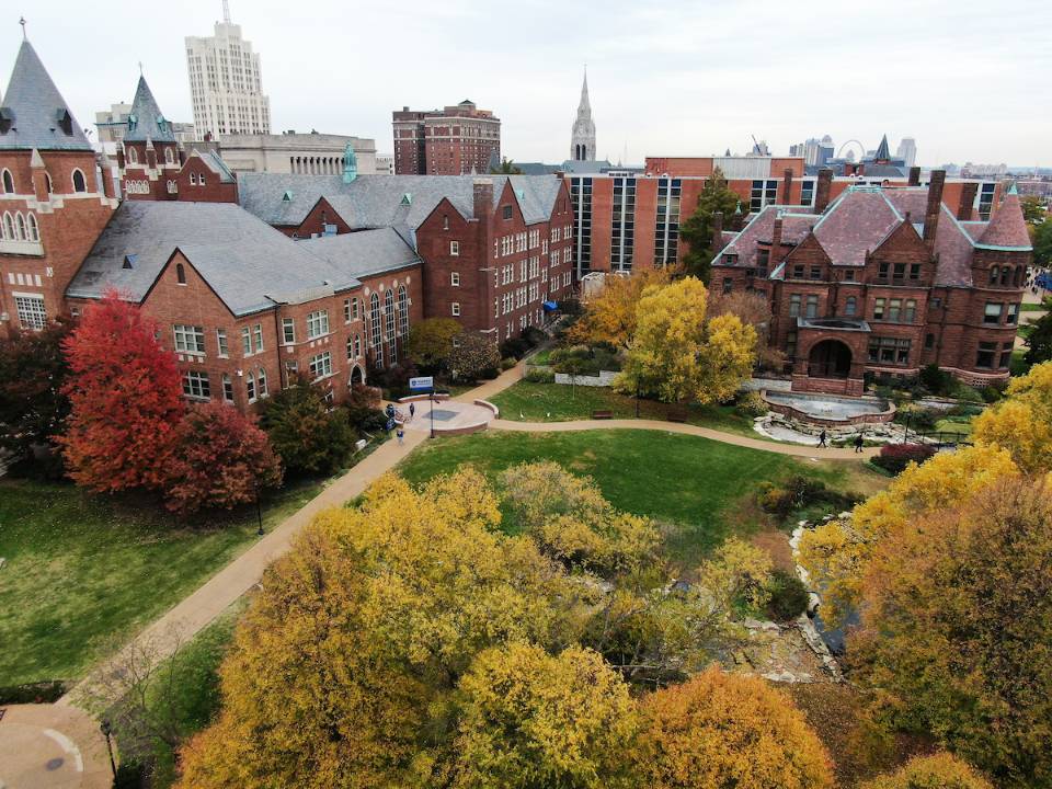SLU's north campus in the autumn, with trees turning red and orange