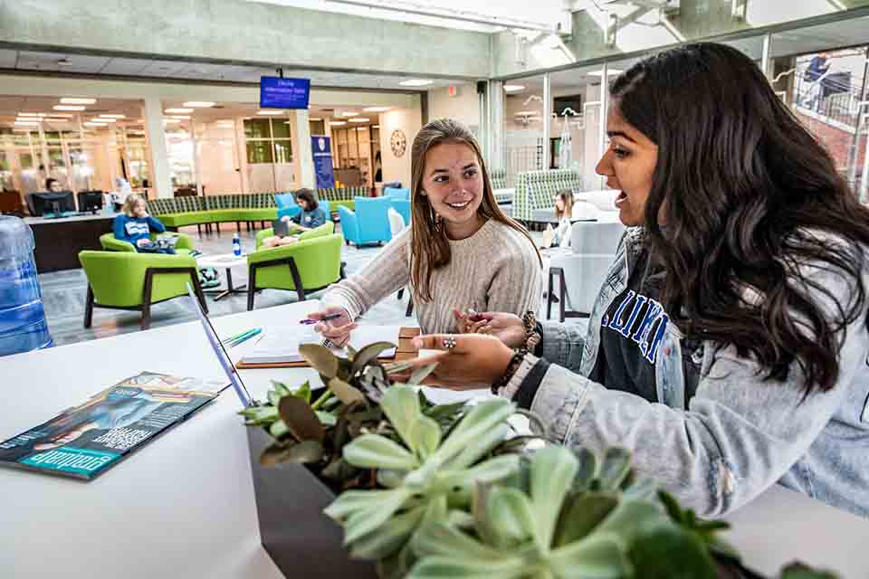 Women doing college research Women doing college research