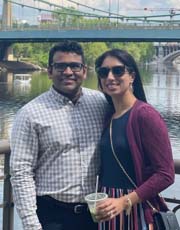 photo of Jay Patel, M.D. standing next to a woman with a river in the background