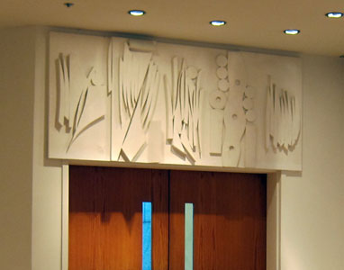 Interior view of the Chapel of the Good Shepherd, St. Peter's Lutheran church, designed by artist Louise Nevelson. Featured is the Grapes and Wheat lintel above the entry doors.