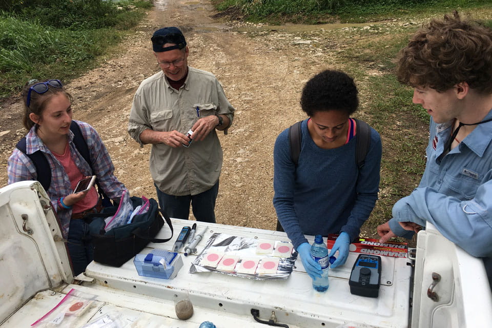 The group tests water samples in Belize