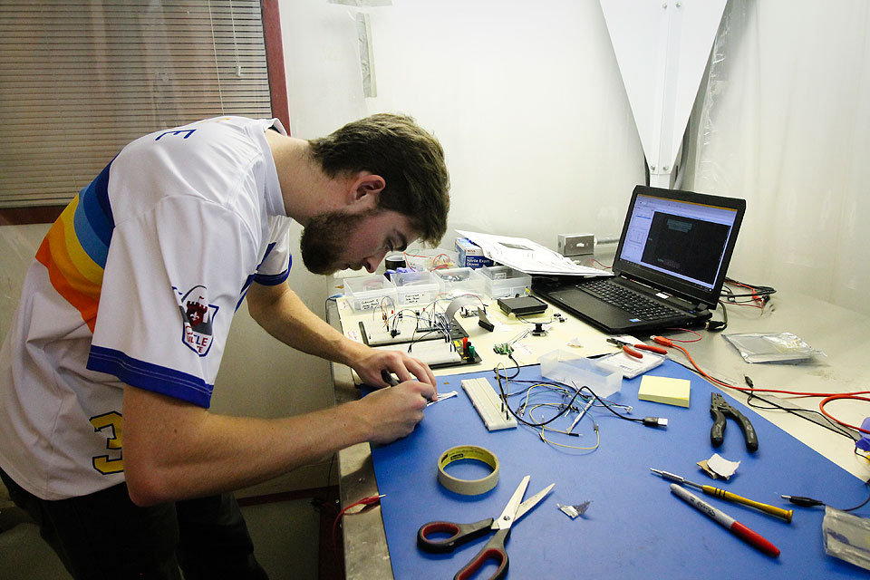 A SLU Student Works on CubeSat