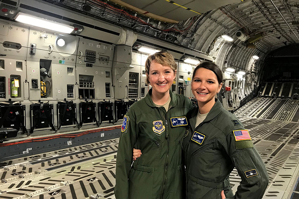 Alicia Canetta (right) joins a colleague inside an Air Craft plane.
