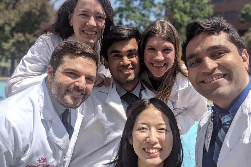 Slide 4 small group photo of six child neurology residents together outdoors