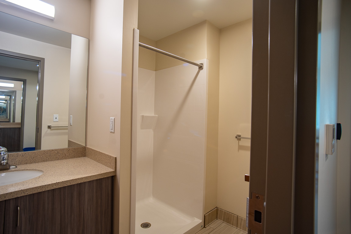 Shared bathroom vanity and shower in Grand Hall