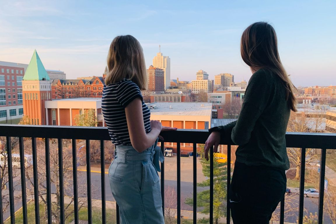 Students on a balcony in Marchetti Towers. 