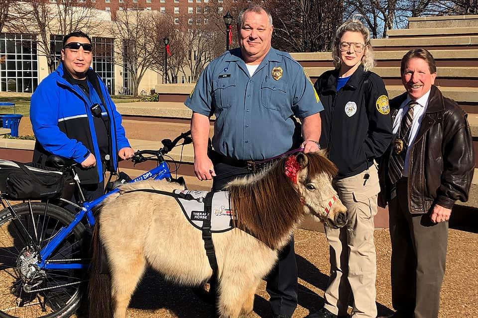 Members of the Department of Public Safety pose with a miniature therapy horse during a De-Stress with DPS visit in December 2018.