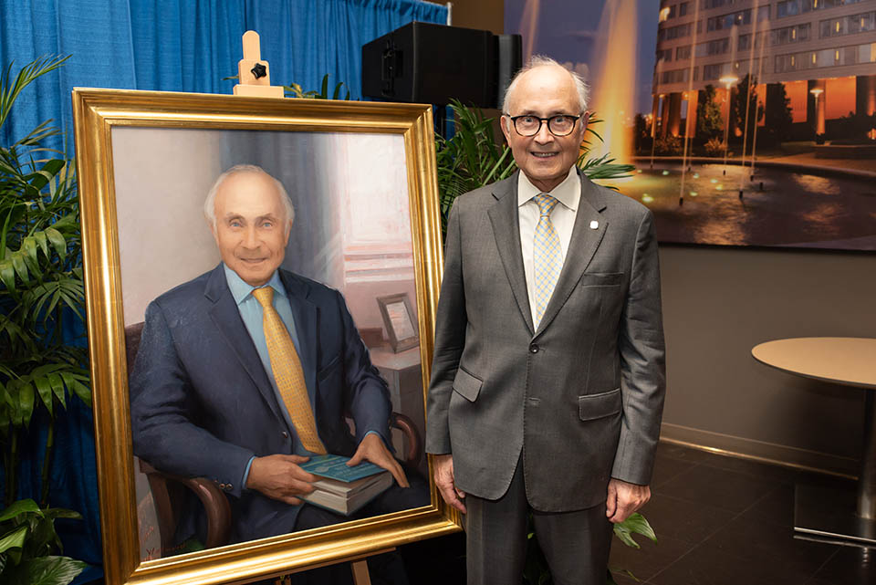 Colleagues and friends from the School of Medicine, SLUCare, SSM Health and across the University joined together Friday, Oct. 22, to celebrate the medical and administrative career of Robert Wilmott, M.D. His portrait was unveiled at the ceremony. Photo by Luke Yamnitz. 