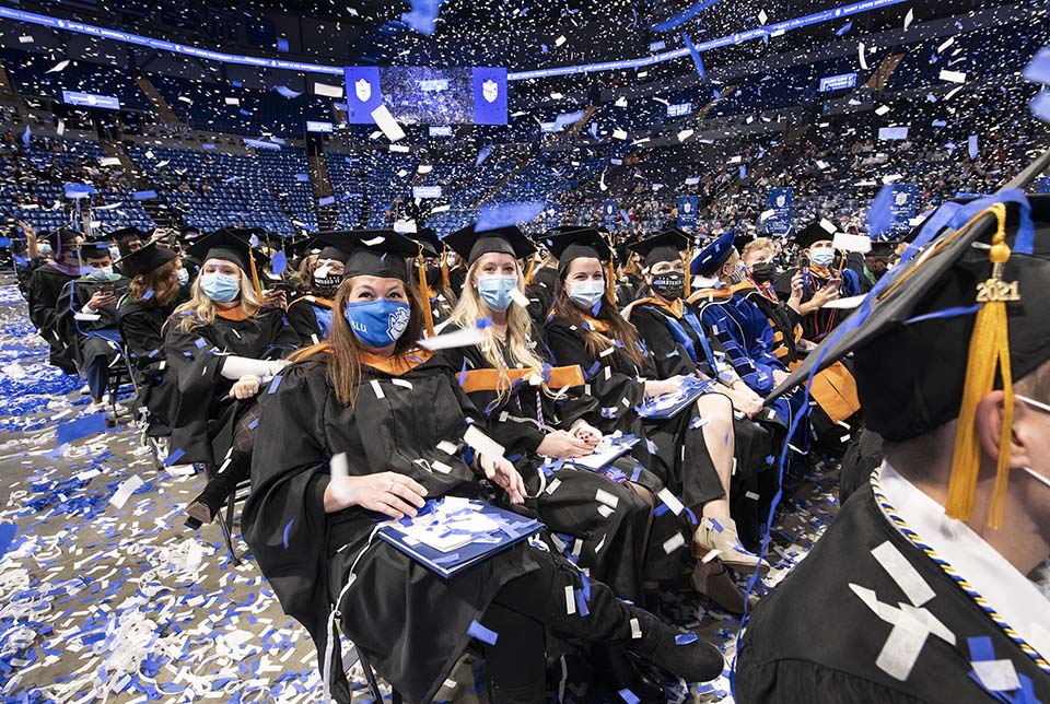 Confetti fell on the new graduates at the end of the 2021 Midyear Commencement Ceremony on Saturday, Jan. 18. Photo by Steve Dolan.  
