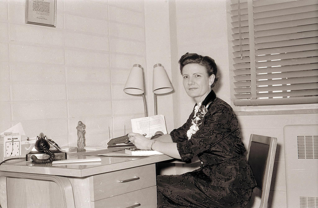 Mary Bruemmer sits at her desk in this photo from 1956, the year she joined SLU’s staff. 