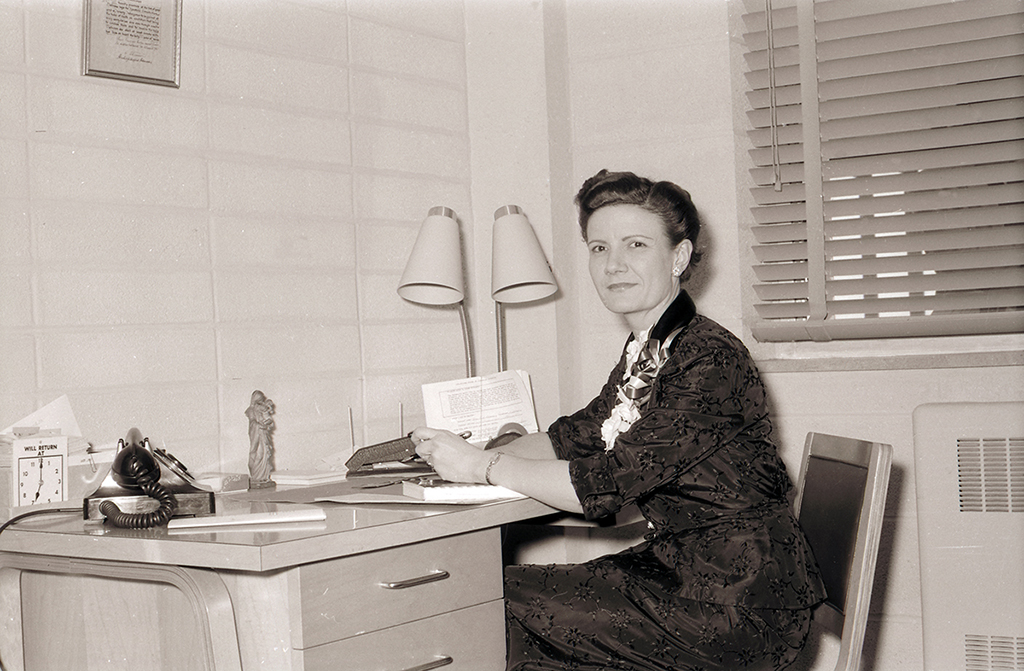 Mary Bruemmer sits at her desk in this photo from 1956, the year she joined SLU’s staff.