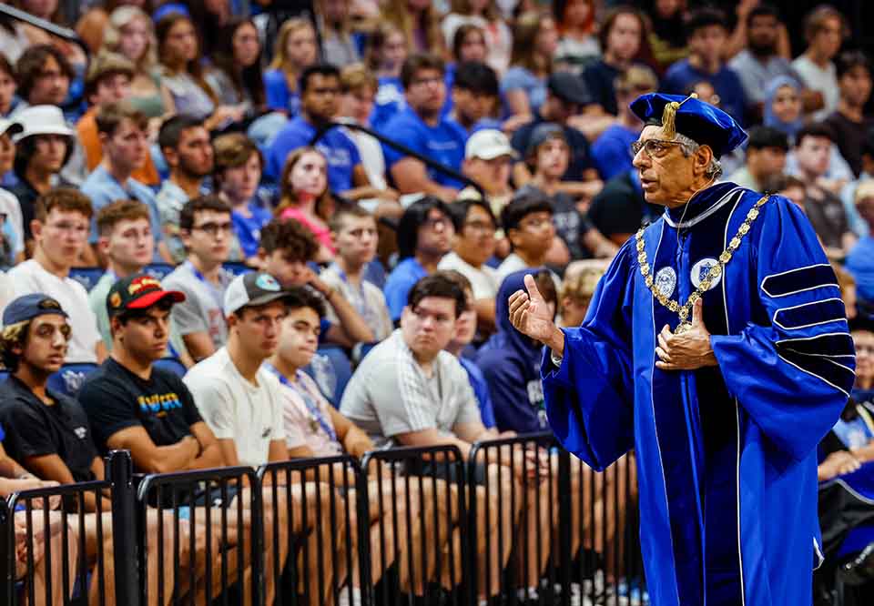 President Fred P. Pestello, Ph.D., delivers the salutation to new students at the 2022 Saint Louis University Convocation at Chaifetz Arena on August 20, 2022. Photo by Sarah Conroy.