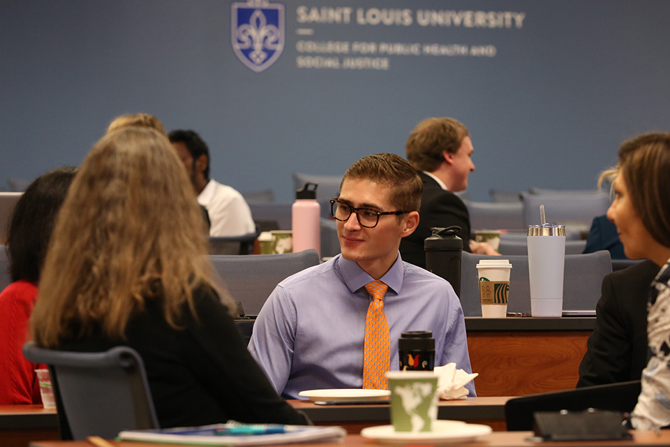 Students and industry leaders network during the Executive Master of Health Administration weekend event.