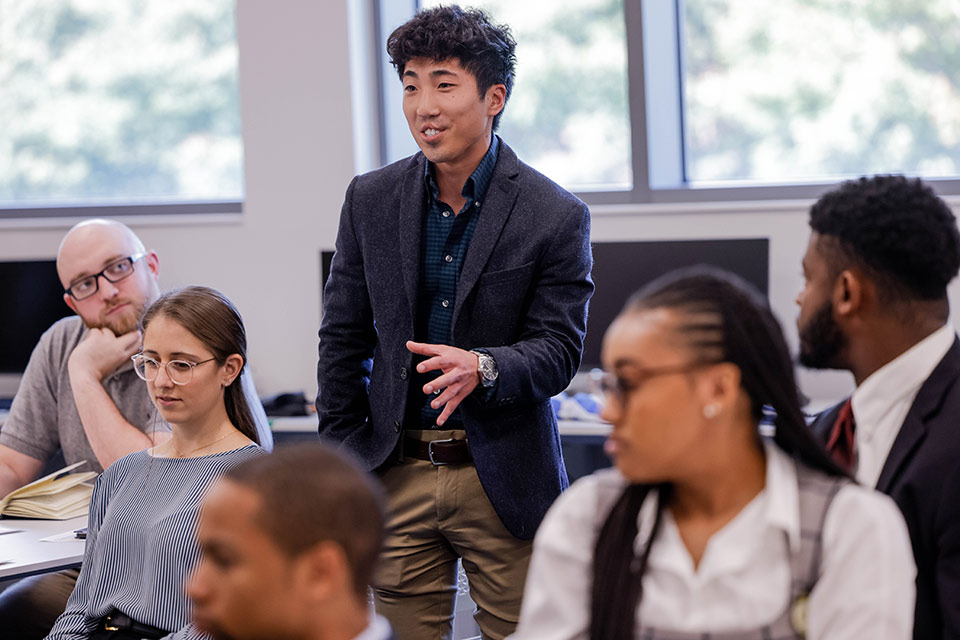 SLU student Kevin Wells poses a questions to U.S. Director of National Intelligence Avril Haines during a talk Oct. 12. Photo by Sarah Conroy.
