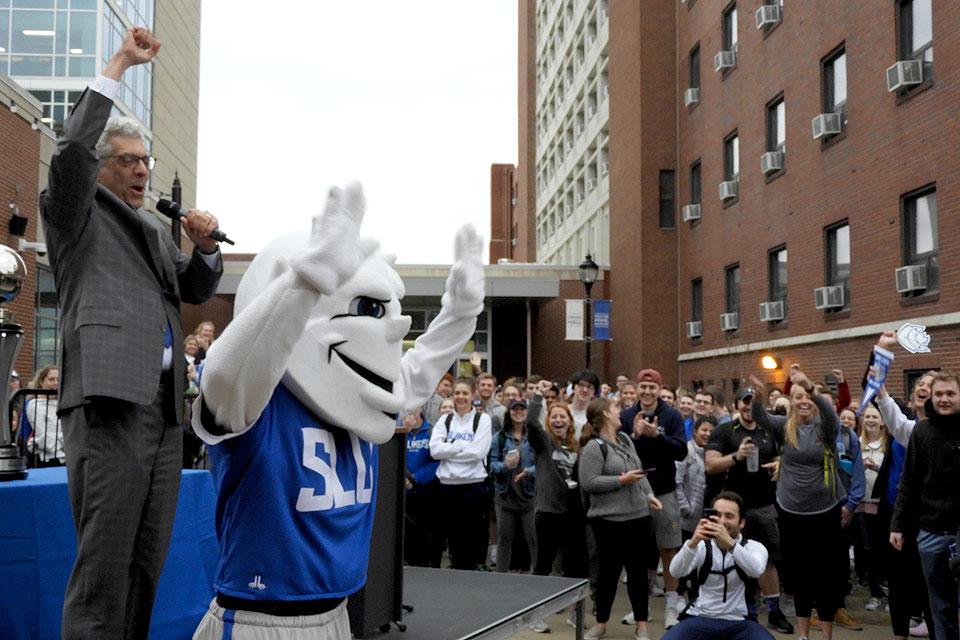 The Billiken celebrates his lucky lottery number and trip to San Jose.