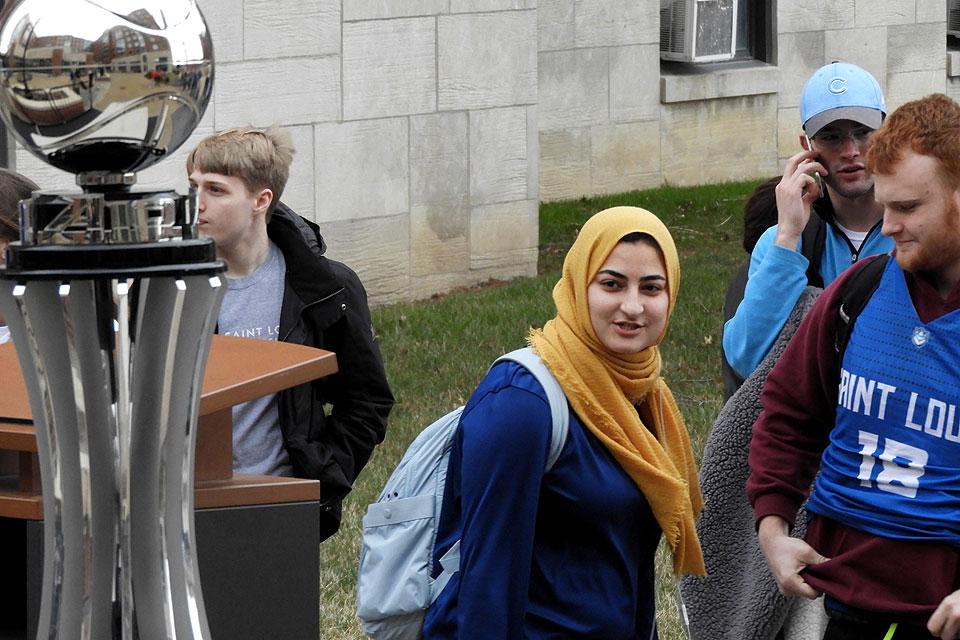 Students get a look at SLU's Atlantic 10 Championship trophy before Wednesday's NCAA Tournament Lottery.