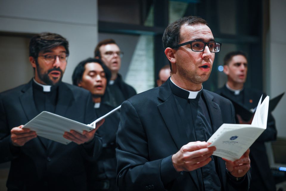 Jesuit scholastics of the Bellermine House of Studies singing during the consecration Mass of the Jesuit Center Chapel on October 25, 2022. Photo by Sarah Conroy.