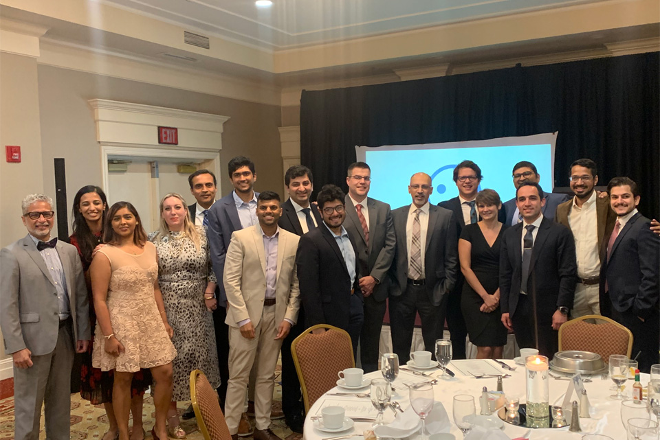 Cardiology residents socializing at formal dinner