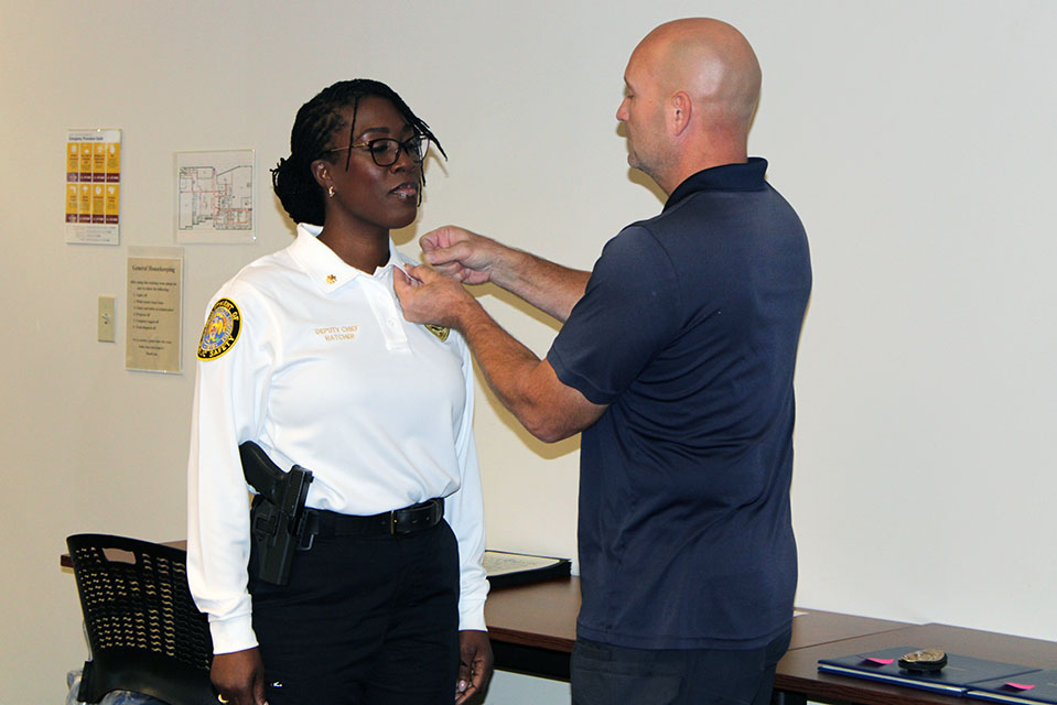 Sheila Hatcher, Major/Deputy Chief, was pinned by her husband, Andy Hatcher, during the DPS pinning ceremony on Wednesday, Nov. 16, 2022. Photo by Joe Barker. 
