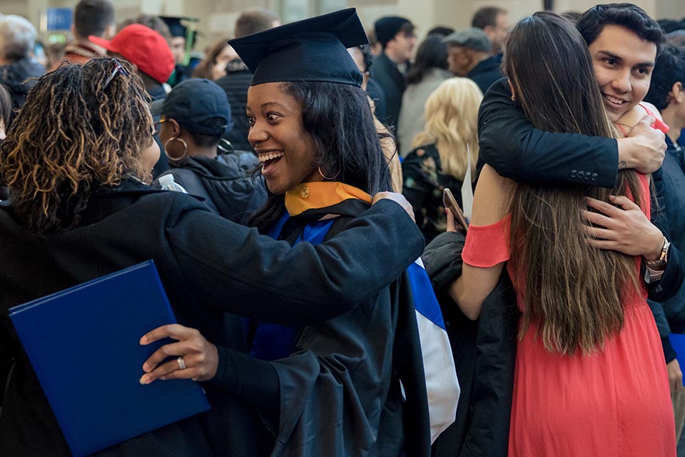 Graduates celebrate with their loved ones after the 2022 Midyear Commencement ceremony at Chaifetz Arena on Saturday, Dec 17, 2022. Photo by Sarah Conroy.