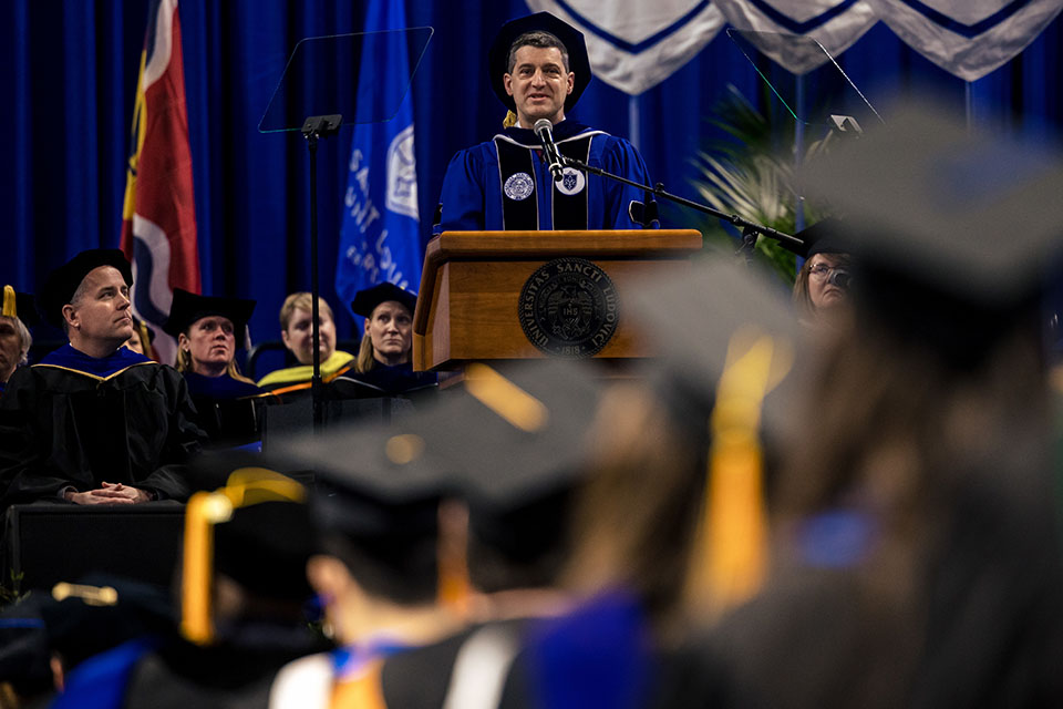 Nancy McNeir Ring Award recipient Mark Ruff, Ph.D., delivers the address during the 2022 Midyear Commencement ceremony at Chaifetz Arena on Saturday, Dec. 17, 2022. Photo by Sarah Conroy.