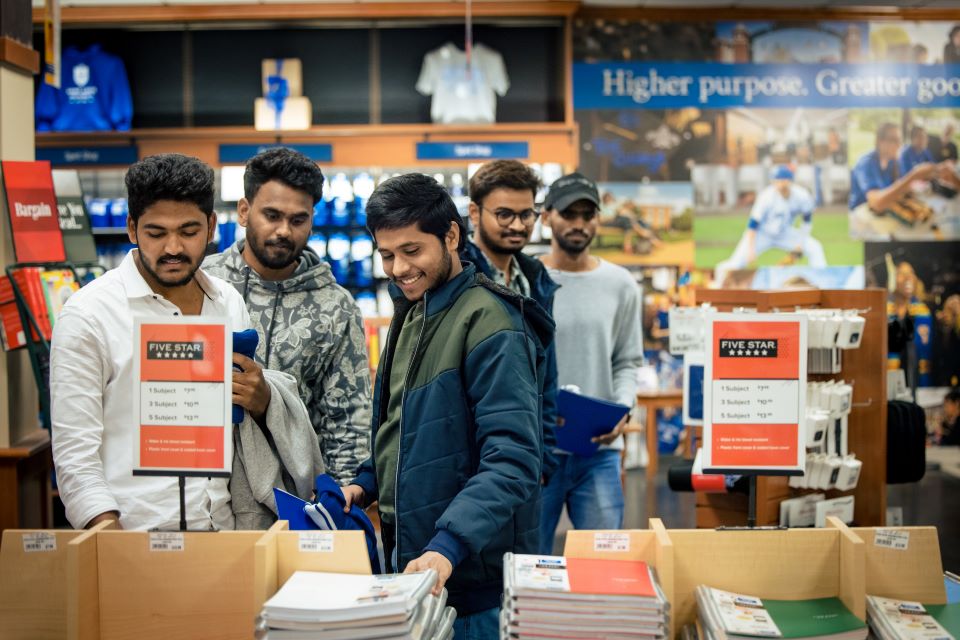 International students visit the bookstore before the campus tour during International Student Orientation on Jan. 12, 2023. Photo by Sarah Conroy. 