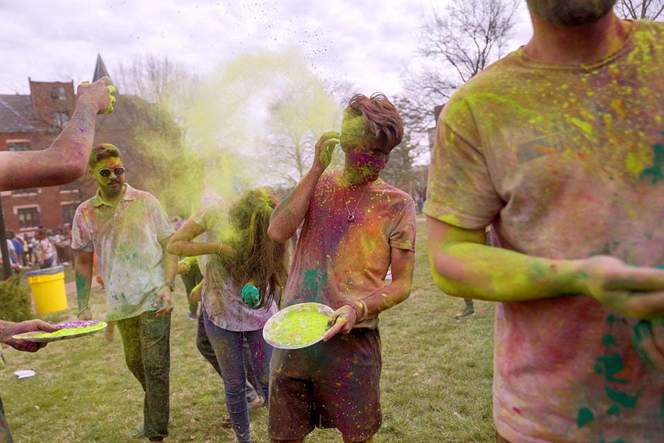 A large group of students gathered on the DuBourg Hall quad on Sunday, March 5, for a Holi celebration. Holi is a Hindu festival of colors. The event was organized by the Office of International Services. Photo by Cristina Fletes.