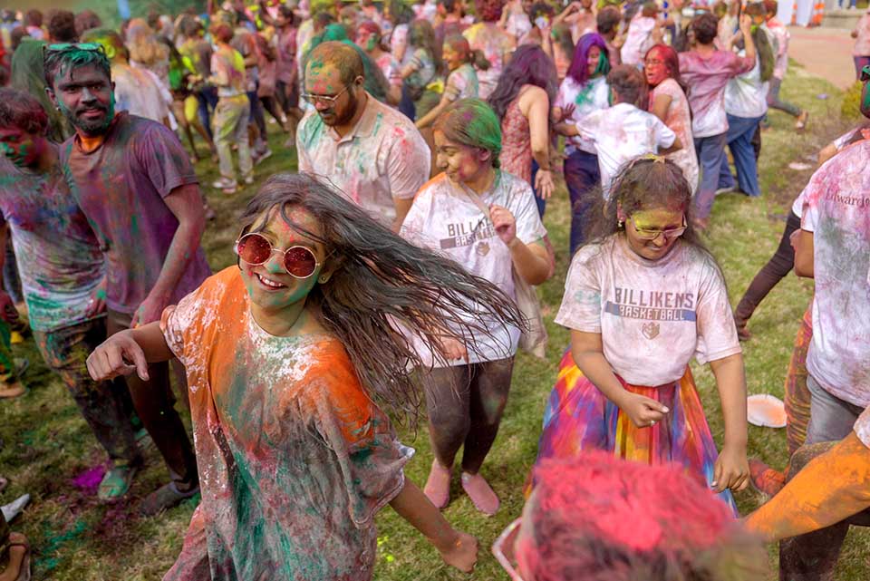 A large group of students gathered on the DuBourg Hall quad on Sunday, March 5, for a Holi celebration. Holi is a Hindu festival of colors. The event was organized by the Office of International Services. Photo by Cristina Fletes.