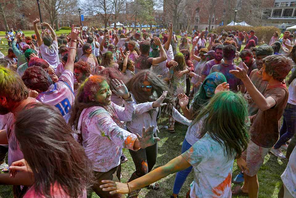A large group of students gathered on the DuBourg Hall quad on Sunday, March 5, for a Holi celebration. Holi is a Hindu festival of colors. The event was organized by the Office of International Services. Photo by Cristina Fletes.