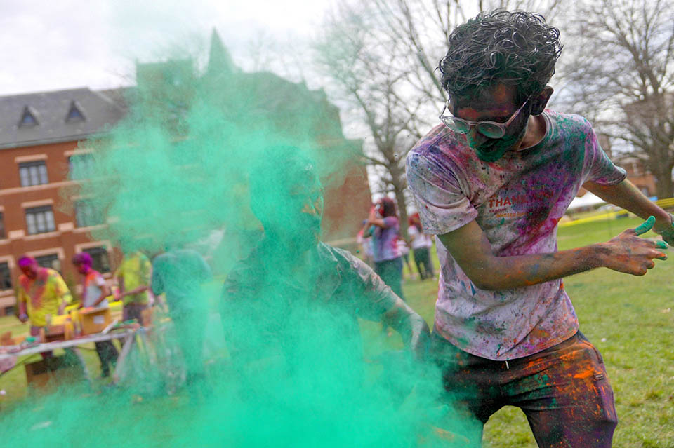 A large group of students gathered on the DuBourg Hall quad on Sunday, March 5, for a Holi celebration. Holi is a Hindu festival of colors. The event was organized by the Office of International Services. Photo by Cristina Fletes.