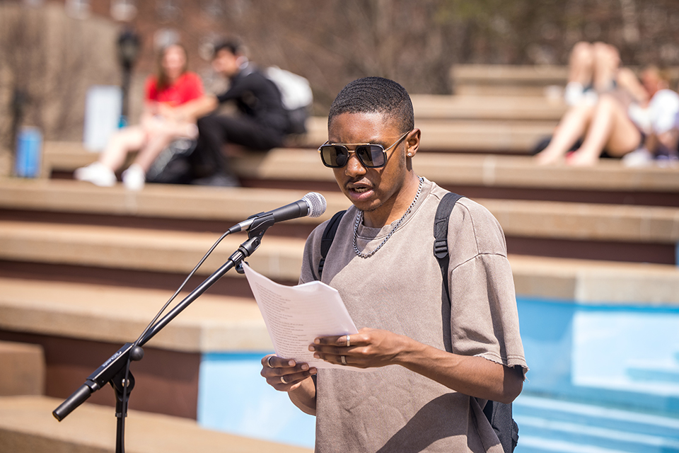 Student Government Association president-elect Marquis Govan reads six-word descriptions of race and identity from the SLU community as part of journalist Michele Norris’ Race Card Project on April 4, 2023.