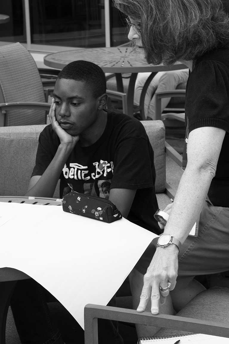 Slide 5: Student engages with instructor of Ignite Communication Seminar