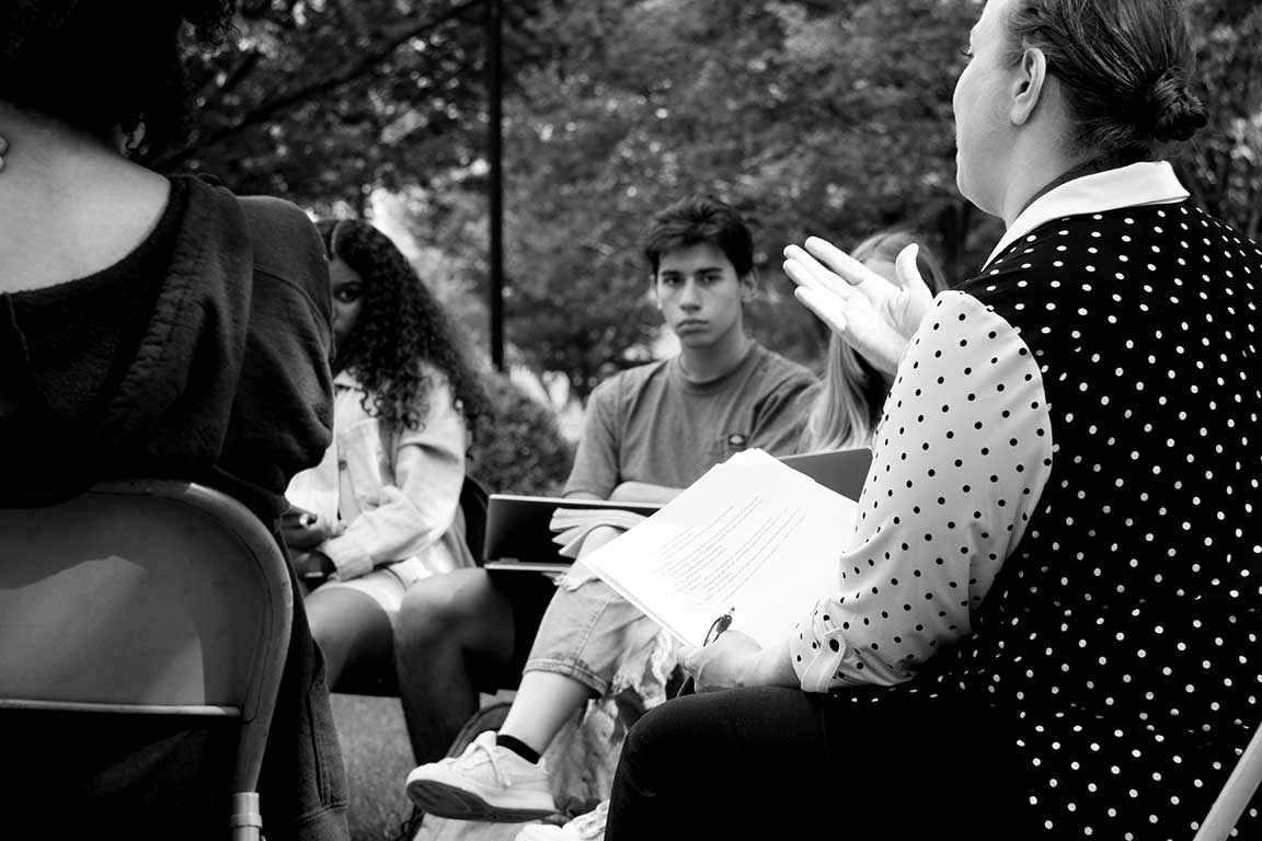 Students listening as faculty speaks about Core