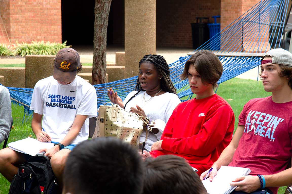 Four students engage in Core discussion