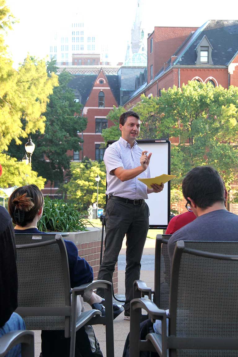 Slide 5: Dr. Daniel Smith leads the seminar out front