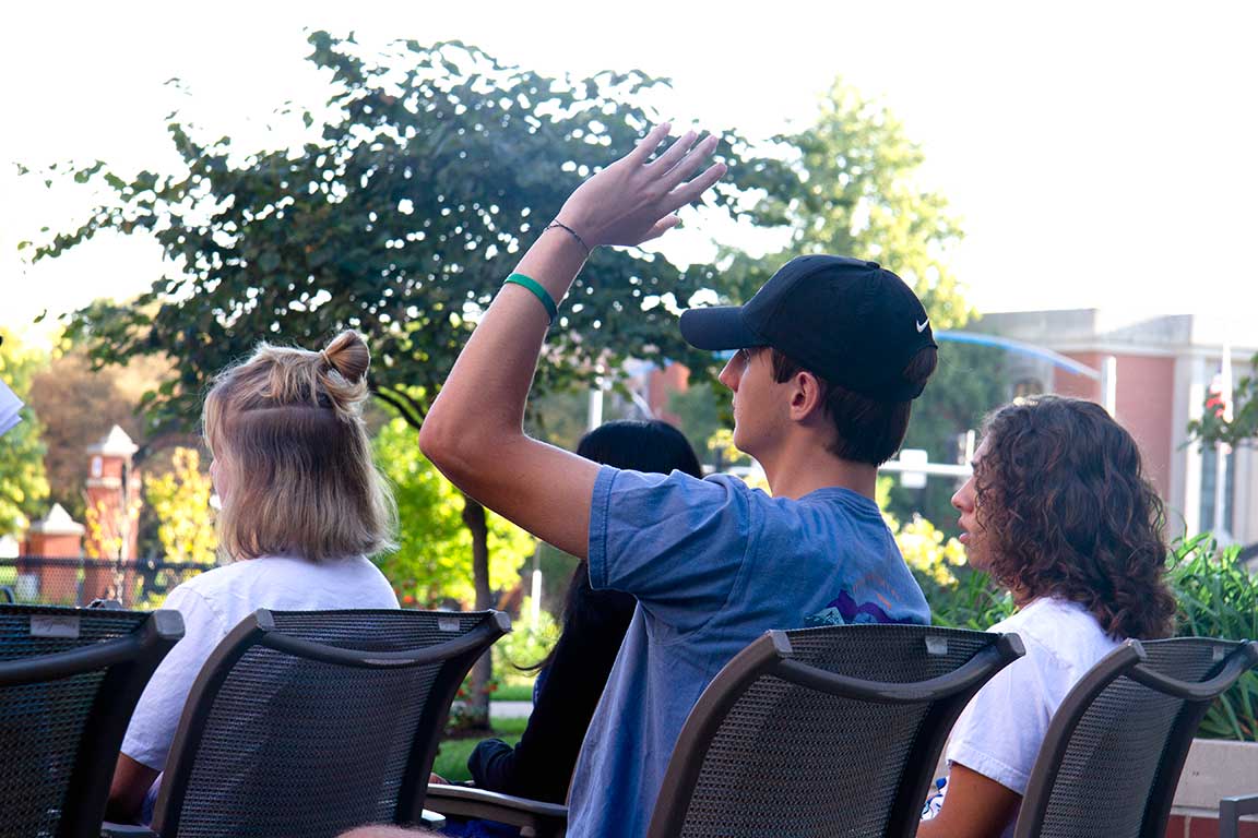 Slide 6: Attendee raises his hand to ask a question