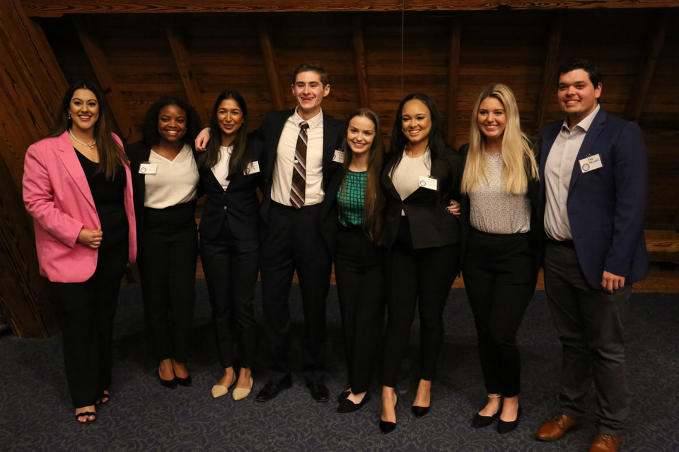 Eight MHA students pose for a photo together.