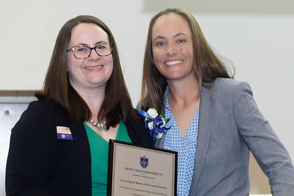 Katie Shields, left, is honored during the 2023 Women of the Year Luncheon on April 24, 2023. She is pictured with Women’s Commission president Eliza Angarano. Photo by Sarah Conroy.
