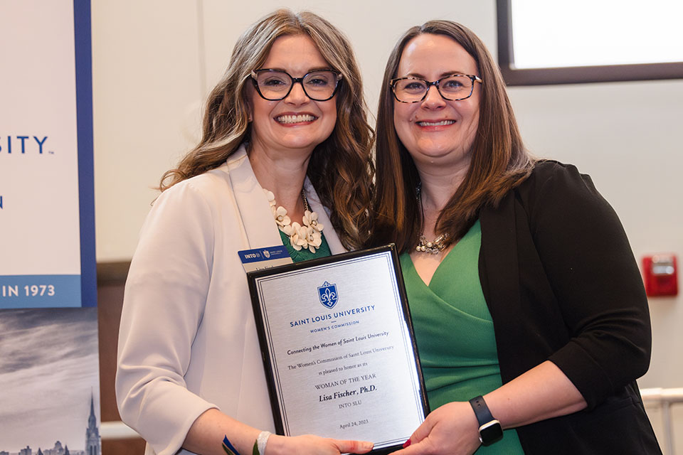 Lisa Fischer, Ph.D., left is honored during the 2023 Women of the Year Luncheon on April 24, 2023. She is pictured with Women’s Commission president Eliza Angarano. Photo by Sarah Conroy.Photo by Sarah Conroy.