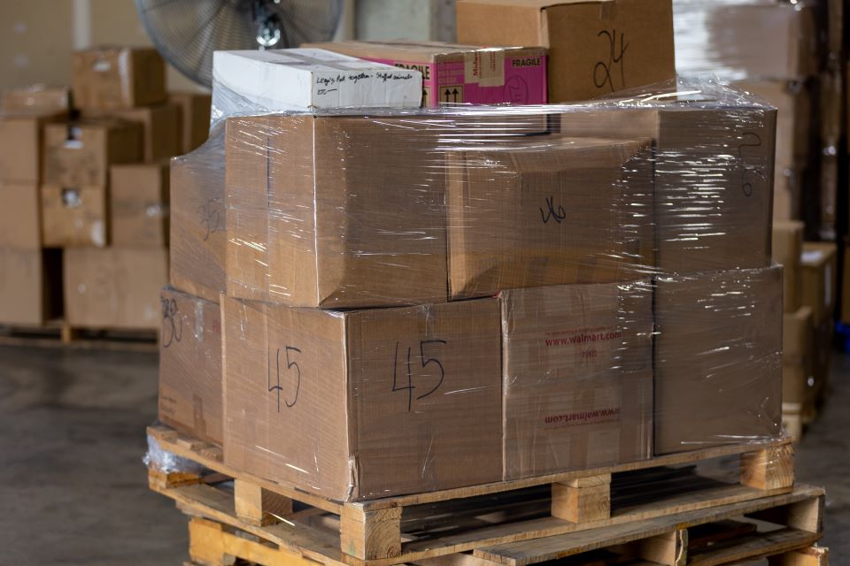 Once stacked, pallets are wrapped for shipping. Photo by David Malone. 