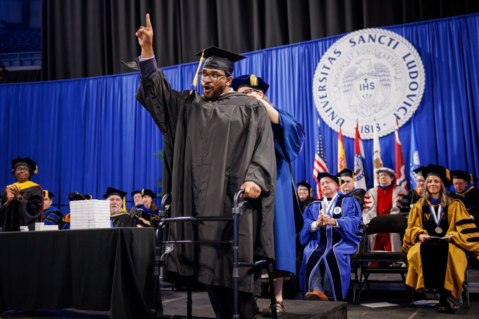 Aniketh Vyas celebrates during the School for Science and Engineering pre-commencement ceremony. Photo by Sarah Conroy. 