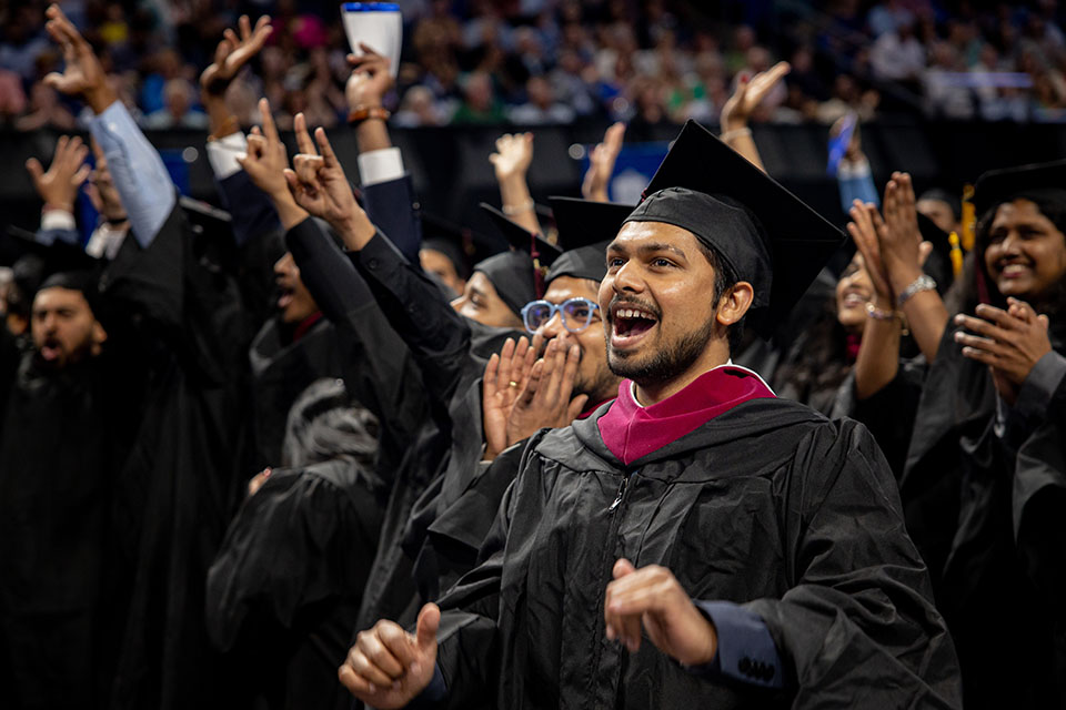 Graduates celebrate at the Spring 2023 Commencement Ceremony on Saturday, May 20, at Chaifetz Arena. Photo by Sarah Conroy. 