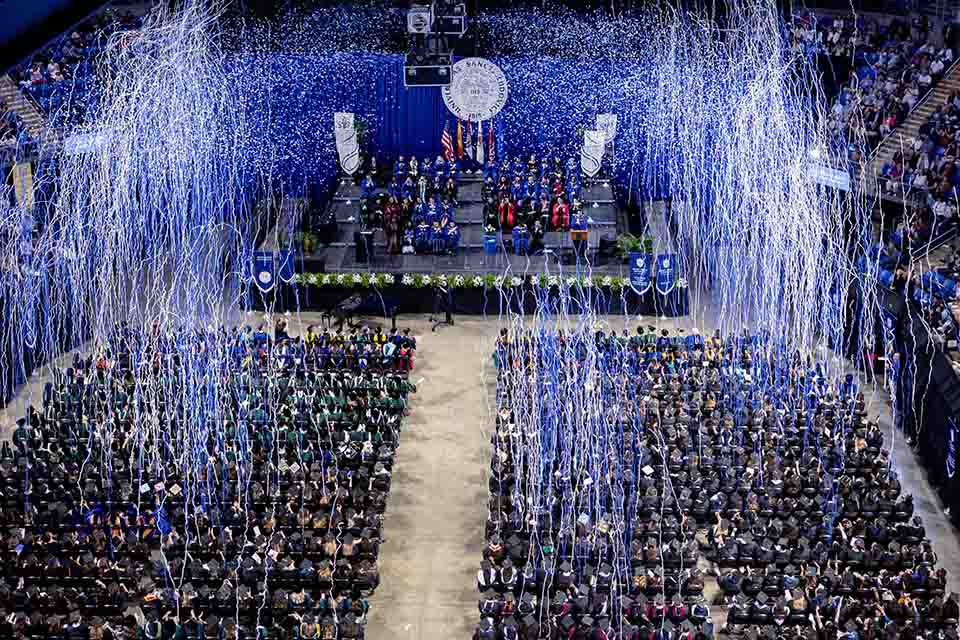 Confetti falls on the Class of 2023 at the Spring Commencement Ceremony on Saturday, May 20, at Chaifetz Arena. Photo by Sarah Conroy. 