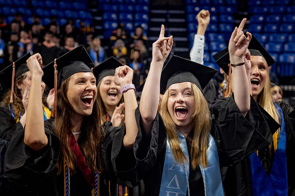 Graduates celebrate at the Spring 2023 Commencement Ceremony on Saturday, May 20, at Chaifetz Arena. Photo by Sarah Conroy. 
