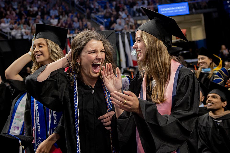 Graduates celebrate at the Spring 2023 Commencement Ceremony on Saturday, May 20, at Chaifetz Arena. Photo by Sarah Conroy. 