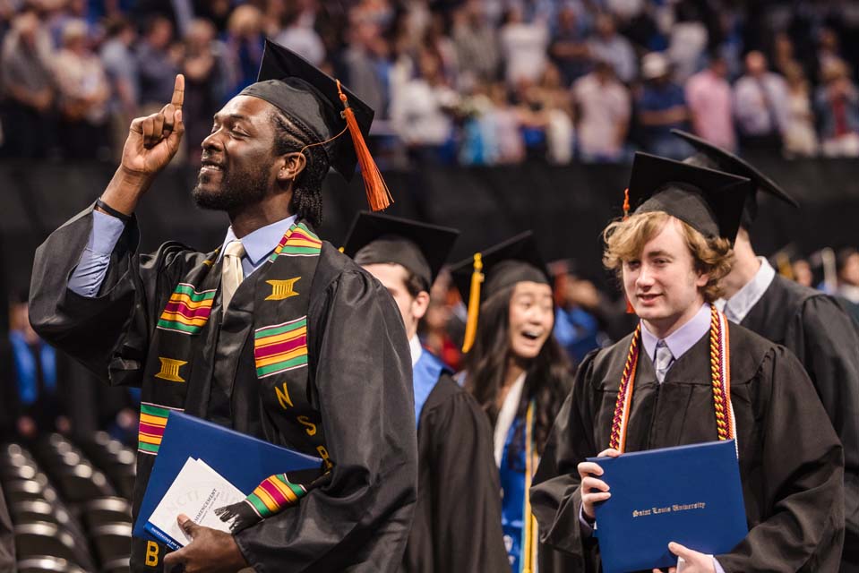 A School of Science and Engineering graduate celebrates after his precommencement ceremony on May 19, 2023. Photo by Sarah Conroy.