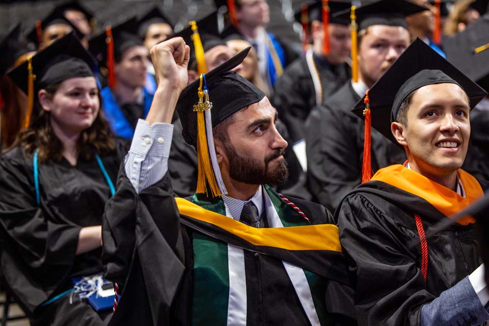A School of Science and Engineering graduate celebrates during his precommencement ceremony on May 19, 2023. Photo by Sarah Conroy.