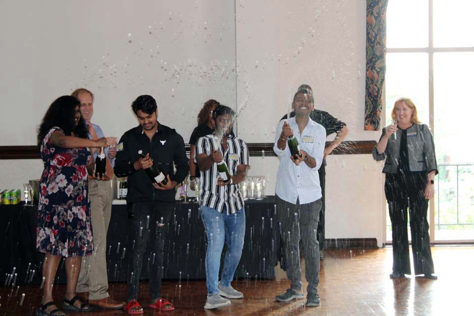 International students celebrate during a graduation event on Wednesday, May 17. Photo by Joe Barker.