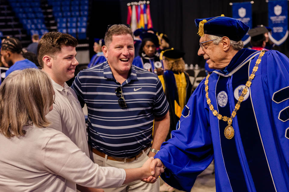 President Fred P. Pestello, Ph.D., greets new families during Convocation at Chaifetz Arena on Saturday, Aug. 19, 2023. Photo by Sarah Conroy.