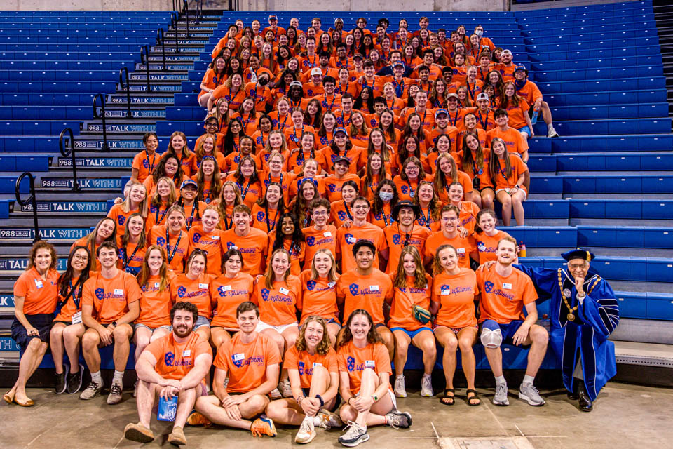 President Fred P. Pestello, Ph.D., poses with Oriflamme after Convocation at Chaifetz Arena on Saturday, Aug. 19, 2023. Photo by Sarah Conroy.